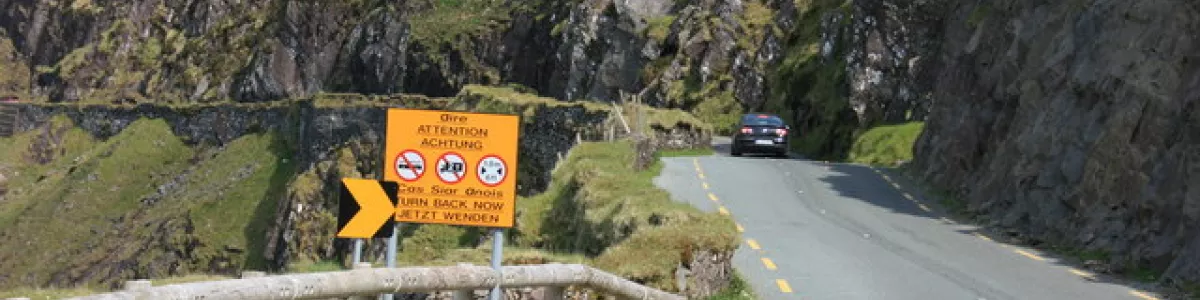 Road warnings on the Connor Pass ...